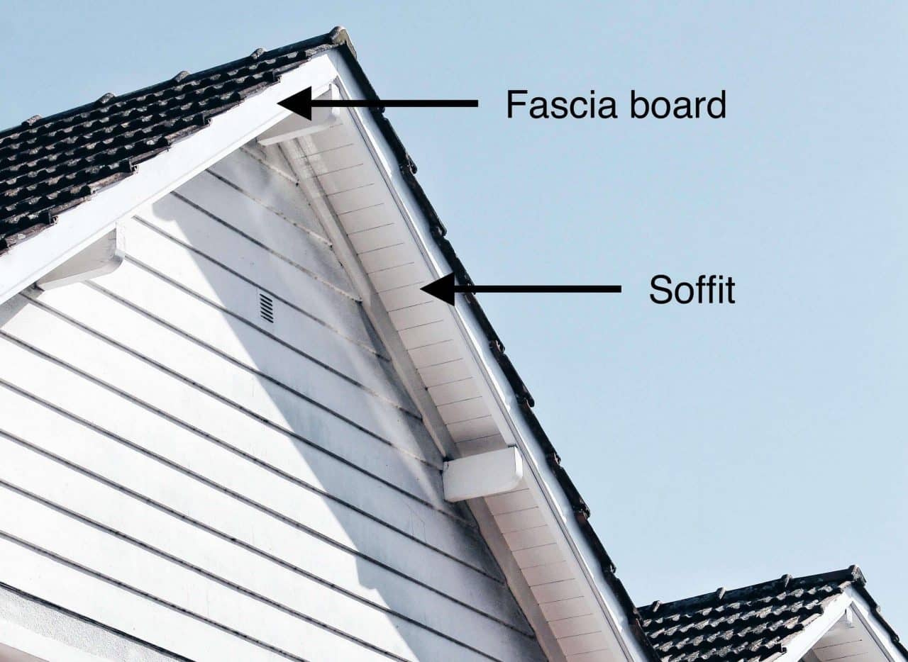House exterior showing roof soffit and fascia boards along the roofline of a Miami home