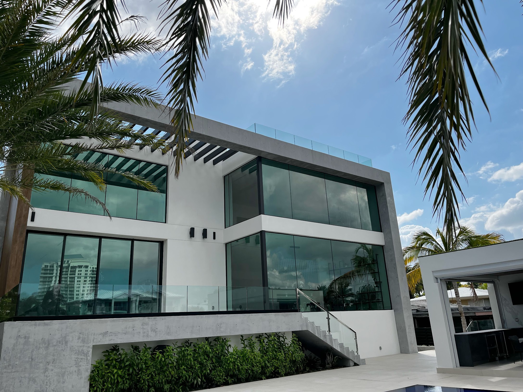 Impact windows installed on a modern Miami home offering hurricane protection