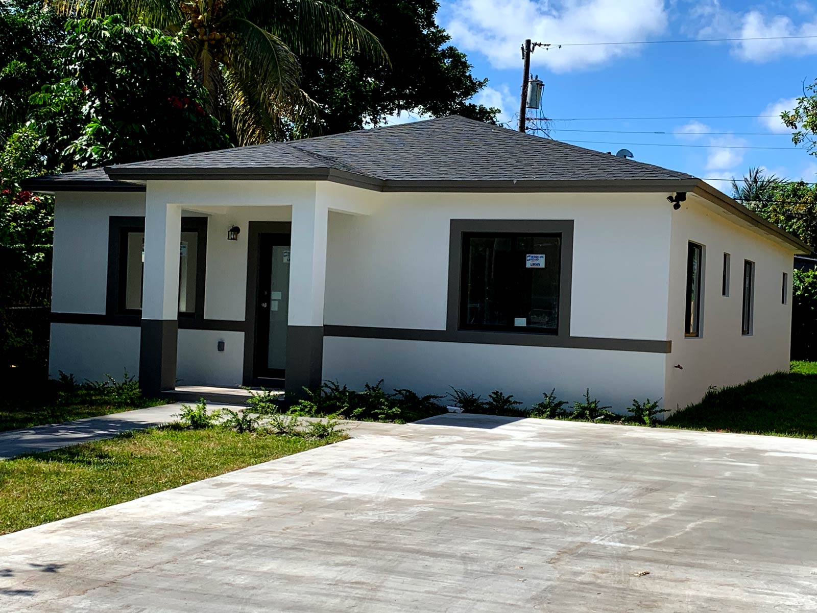 Miami home with asphalt shingle roof used for roof replacement cost comparison