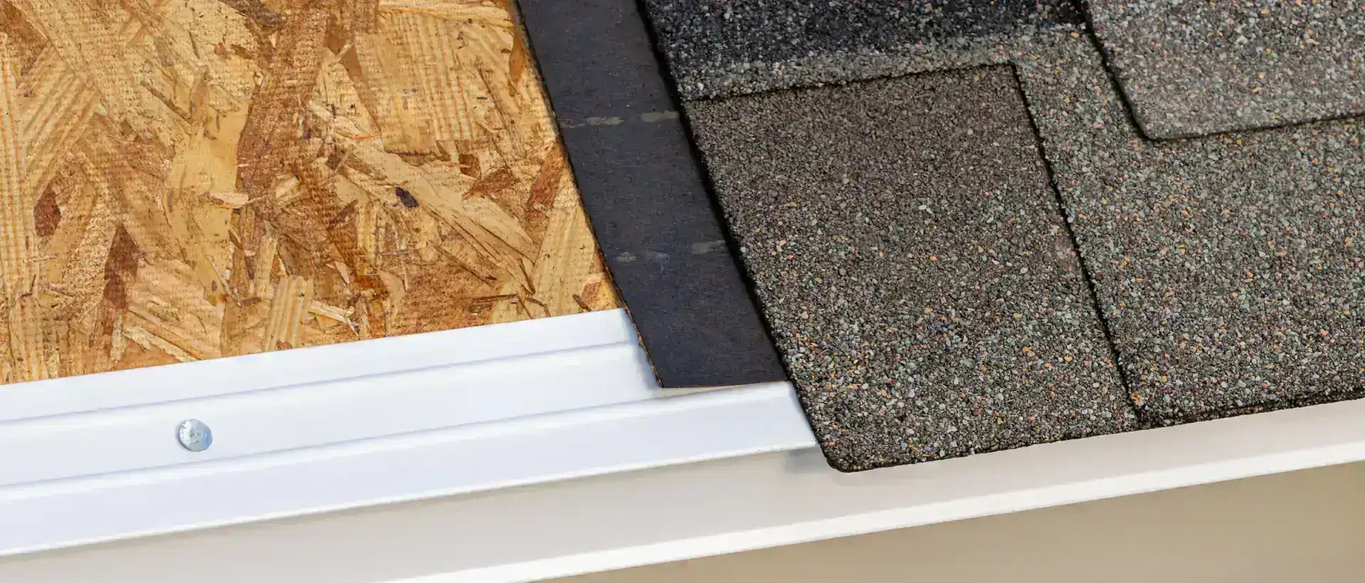 Metal roof drip edge flashing being installed along the roof edge of a Miami, Florida home