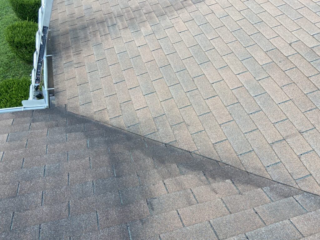 Residential roof with a leaking valley being inspected for repair in Miami, Florida